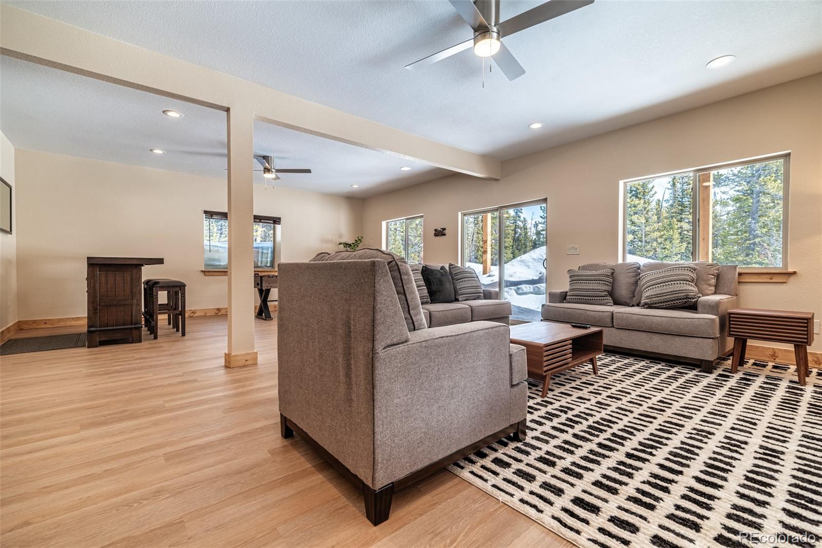 526 Porcupine Road Fairplay, CO 80440 - Photo 28 of 46 a living room with furniture and a wooden floor