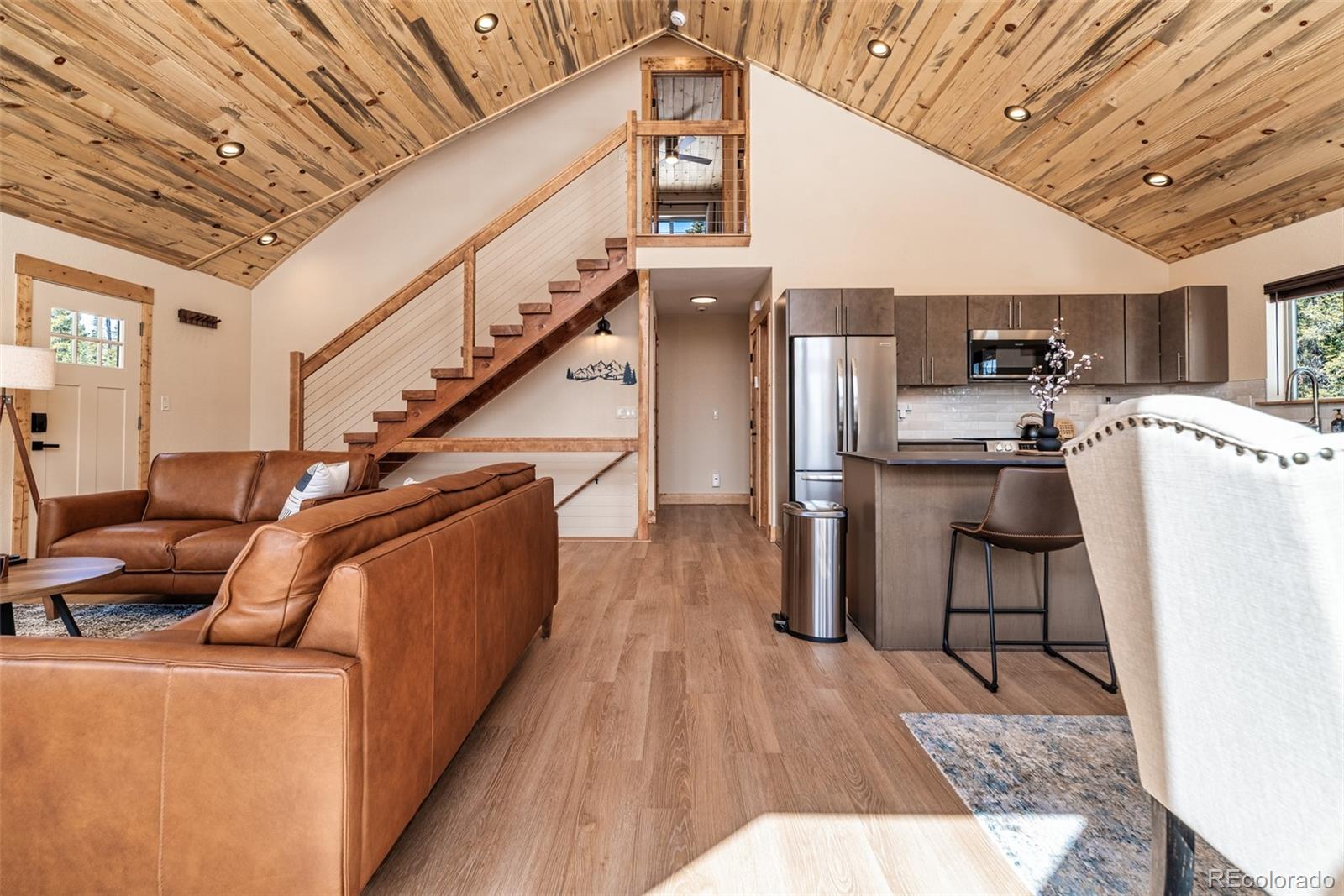 526 Porcupine Road Fairplay, CO 80440 - Photo 9 of 46 a living room with stainless steel appliances kitchen island granite countertop furniture and a kitchen view