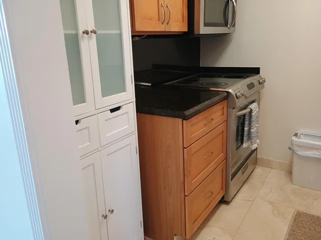 a close view of cabinet and washer