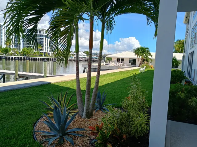 a view of a garden with a house