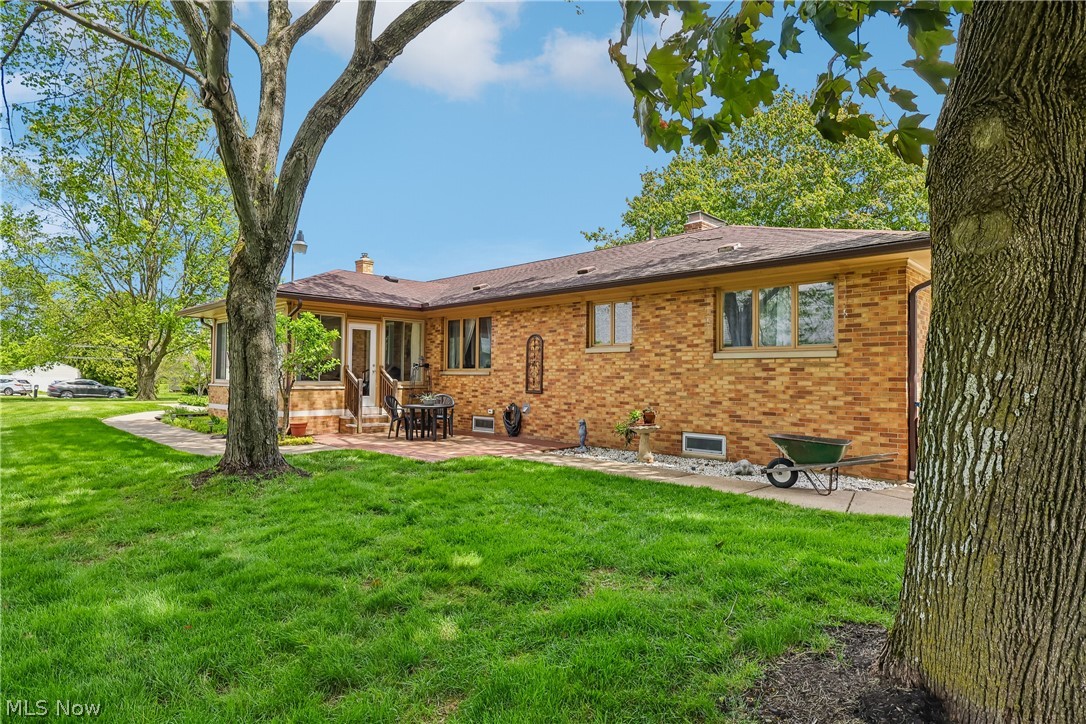 836 Jacoby Road Akron, OH 44333 - Photo 42 of 45 Rear view of home showing sunroom and brick patio