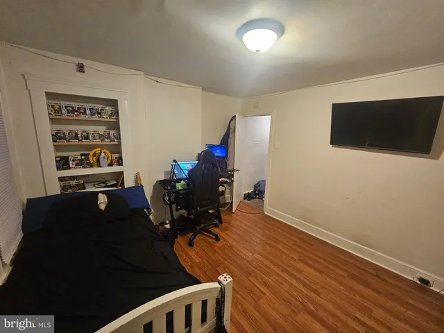 a bedroom with furniture and a chandelier