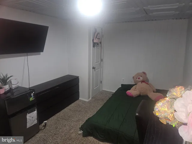 a bedroom with furniture and a bed