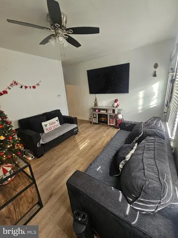 a room with gym equipment and a flat screen tv