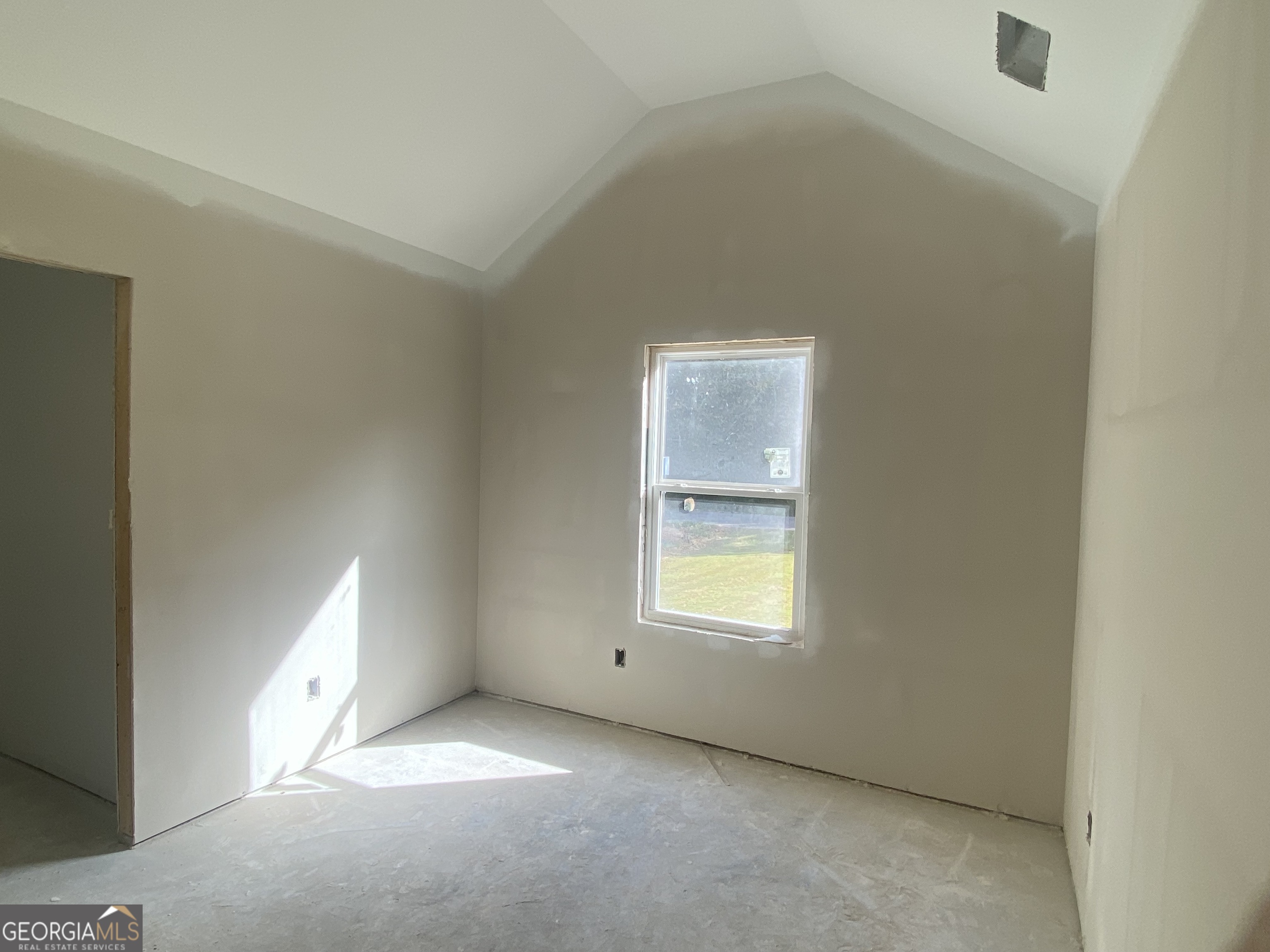 168 Mathews Road Milner, GA 30257 - Photo 11 of 14 an empty room with a window