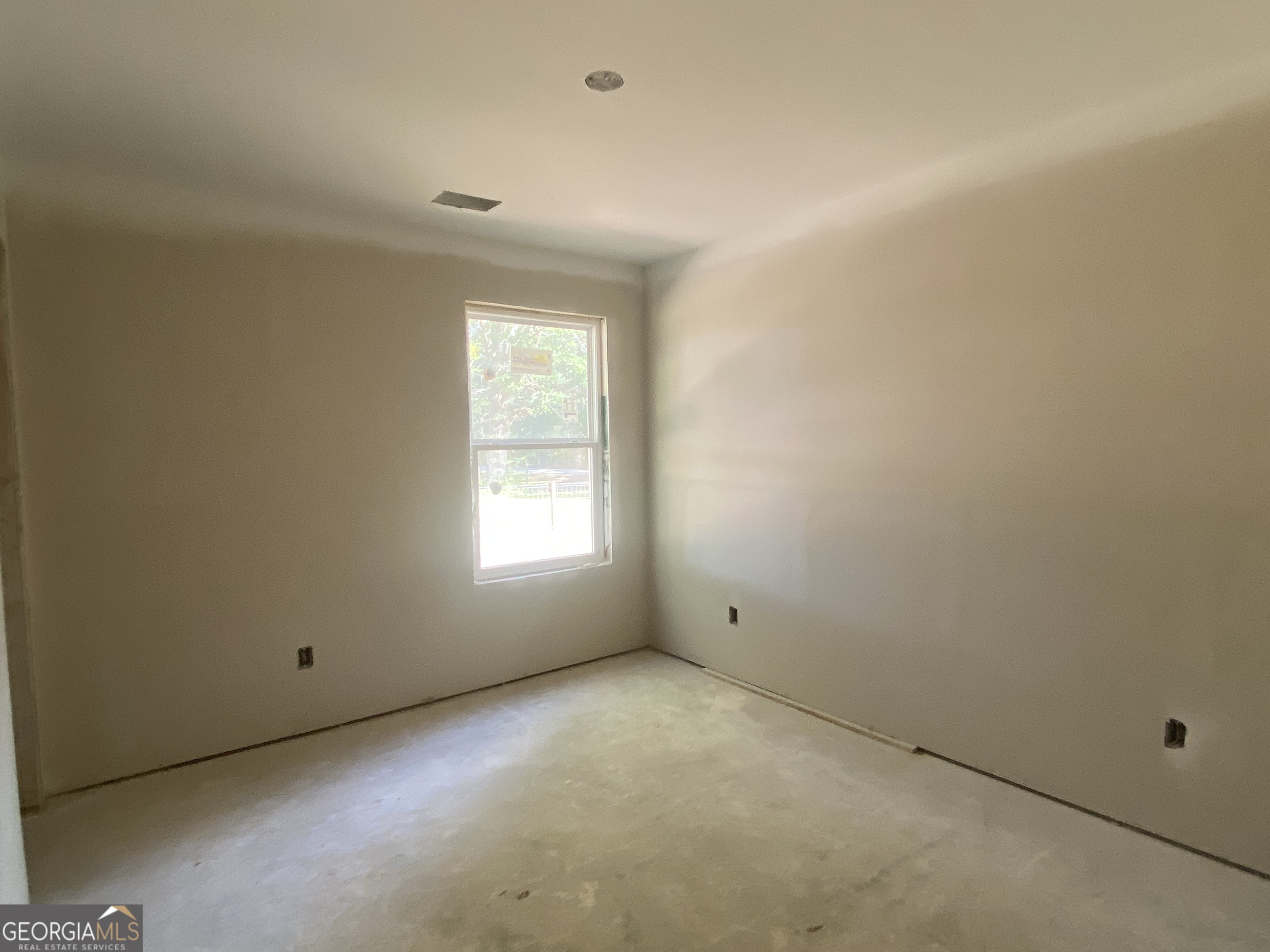 168 Mathews Road Milner, GA 30257 - Photo 12 of 14 an empty room with a window