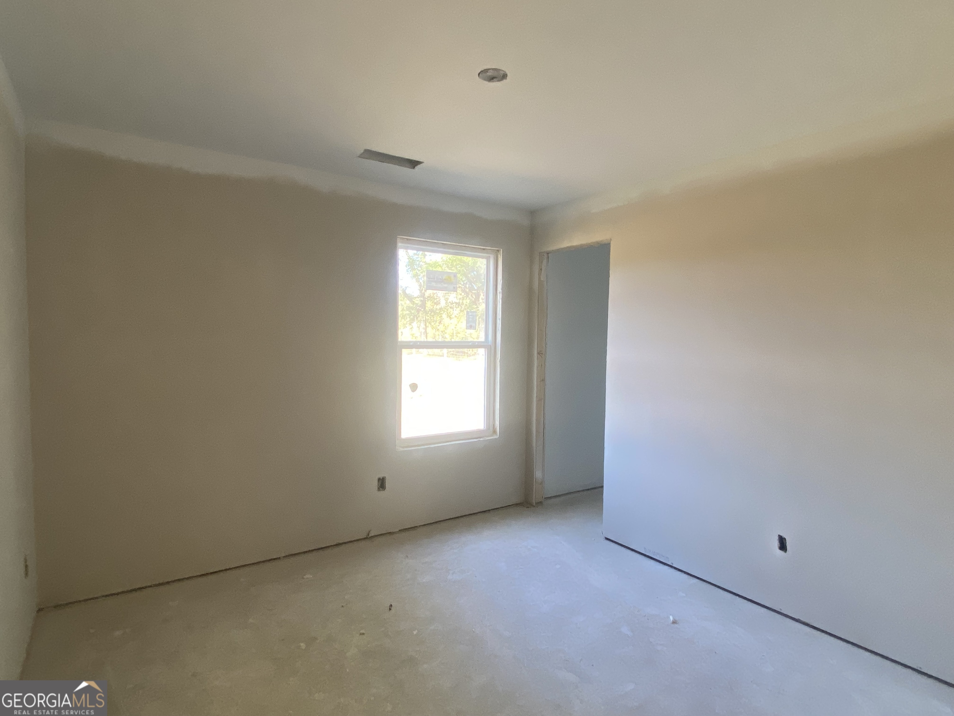 168 Mathews Road Milner, GA 30257 - Photo 13 of 14 an empty room with a window