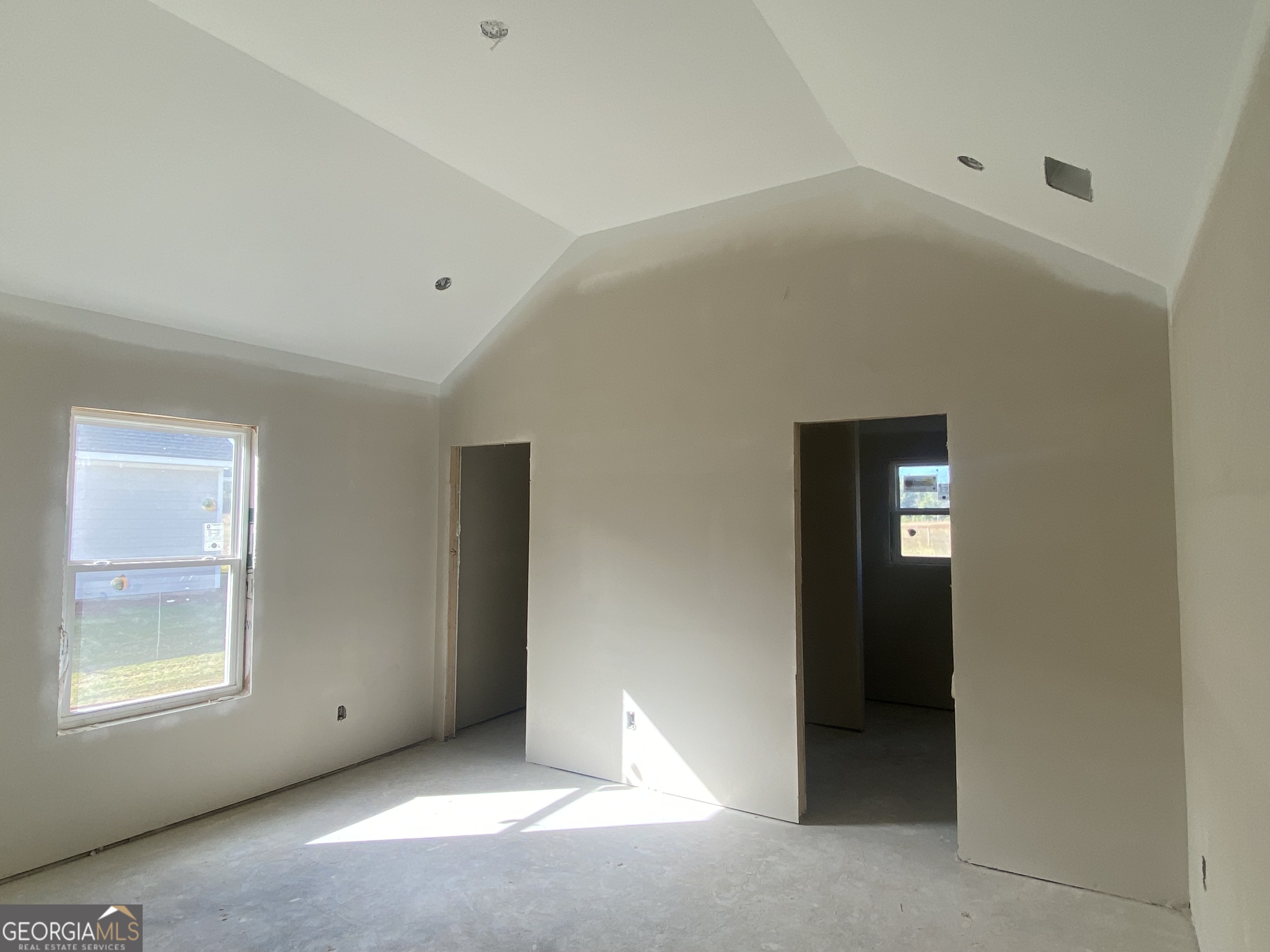 168 Mathews Road Milner, GA 30257 - Photo 6 of 14 an empty room with windows