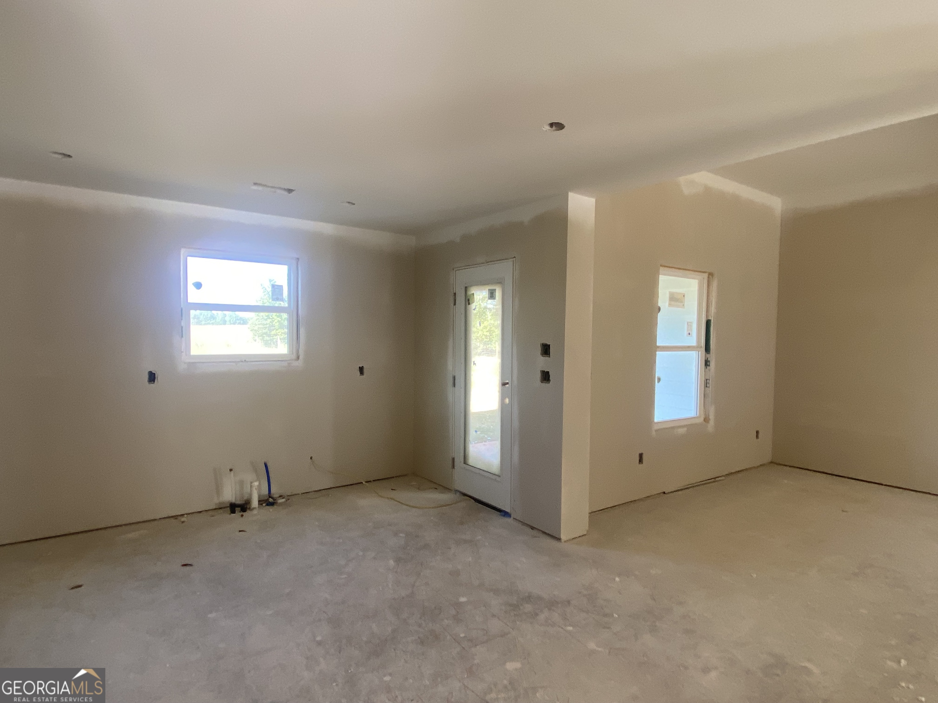 168 Mathews Road Milner, GA 30257 - Photo 8 of 14 an empty room with windows