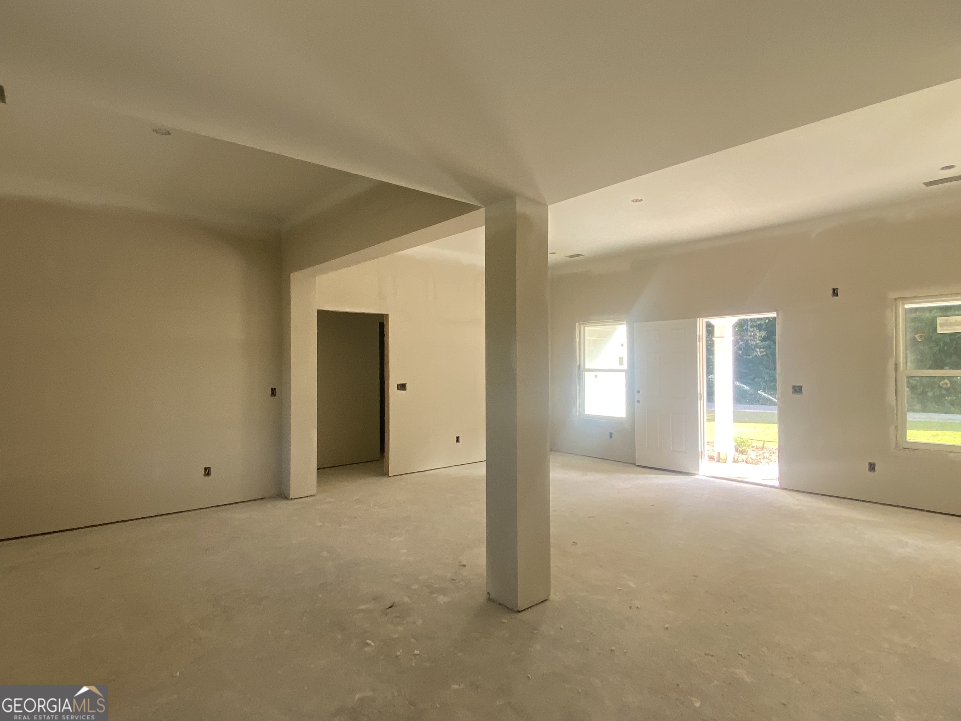 168 Mathews Road Milner, GA 30257 - Photo 9 of 14 an empty room with windows