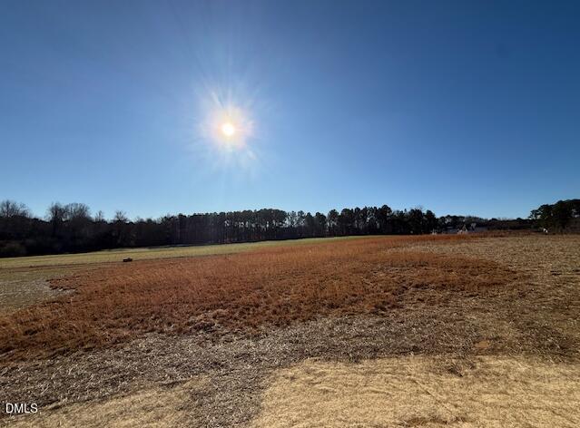 76 Alden Way Angier, NC 27501 - Photo 20 of 25 a view of lake and sunset