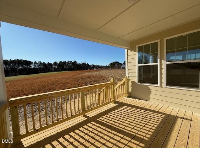 76 Alden Way Angier, NC 27501 - Photo 21 of 25 a view of a balcony with wooden floor and outdoor space