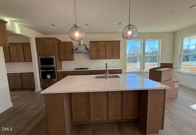 76 Alden Way Angier, NC 27501 - Photo 5 of 25 a kitchen with kitchen island a sink appliances and a counter top space