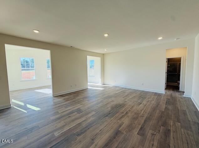 76 Alden Way Angier, NC 27501 - Photo 9 of 25 a view of an empty room with wooden floor