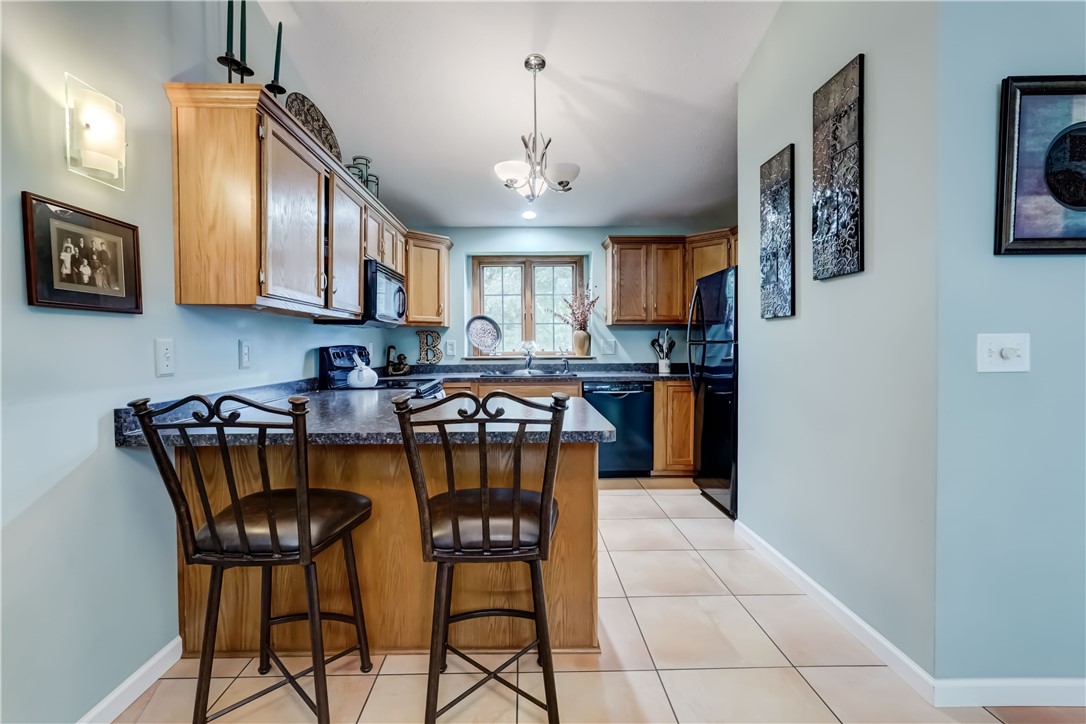 6 Daisy Lane Chili, NY 14514 - Photo 7 of 34 Breakfast bar provides plenty of counter space!