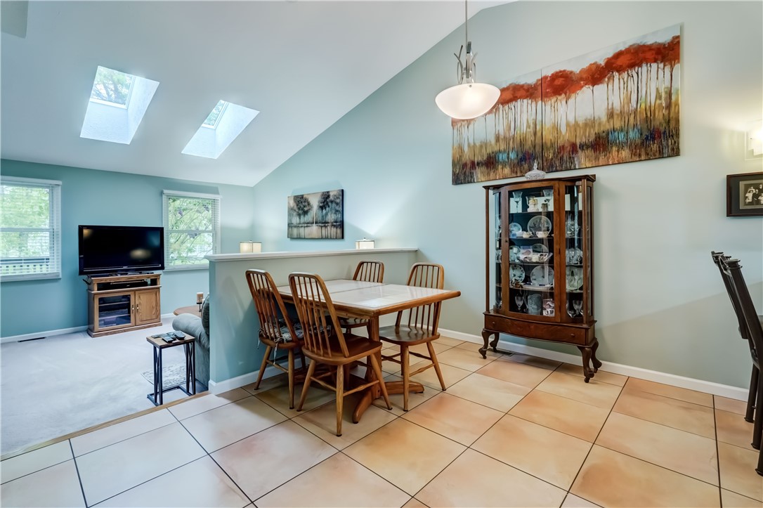 6 Daisy Lane Chili, NY 14514 - Photo 10 of 34 Knee wall separates eat in kitchen from the family