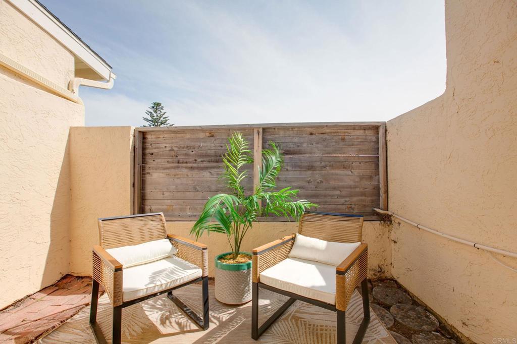 810 Caminito Del Mar Carlsbad, CA 92011 - Photo 13 of 30 a view of chair and table in the balcony
