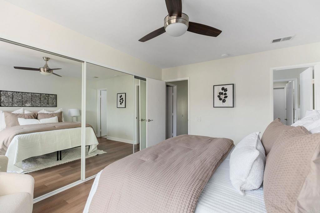 810 Caminito Del Mar Carlsbad, CA 92011 - Photo 14 of 30 a bedroom with a bed and a lamp