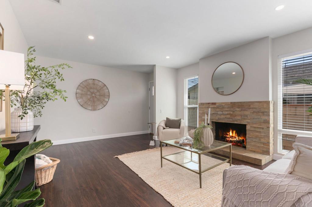 810 Caminito Del Mar Carlsbad, CA 92011 - Photo 7 of 30 a living room with furniture and a fireplace
