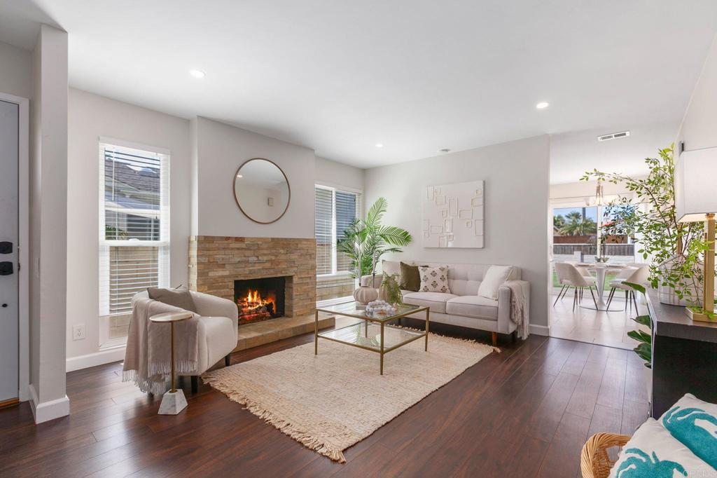 810 Caminito Del Mar Carlsbad, CA 92011 - Photo 8 of 30 a living room with furniture and a fireplace