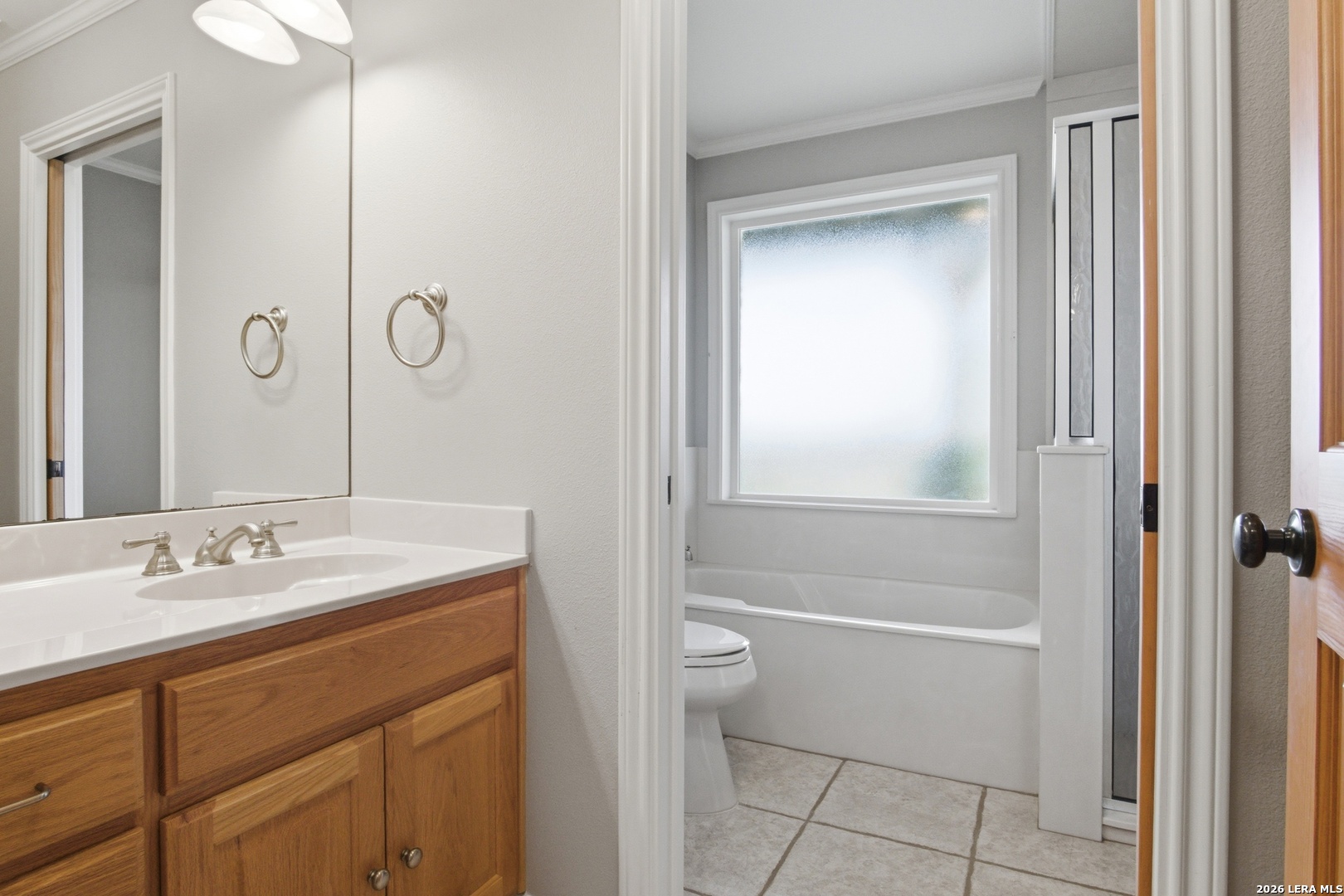 26 Seewald Road Boerne, TX 78006 - Photo 31 of 33 a bathroom with a granite countertop sink a toilet and shower