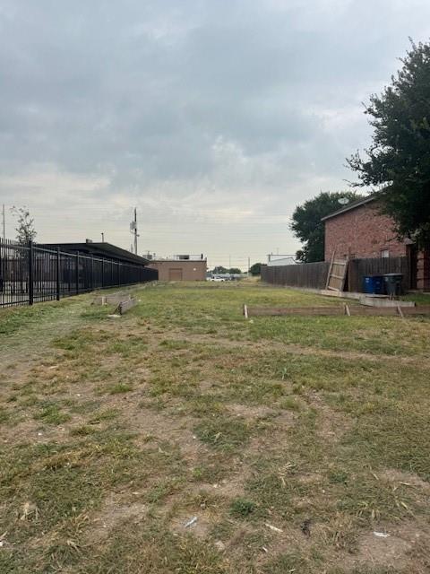 4105 Preferred Place Dallas, TX 75237 - Photo 2 of 3 a view of a lake with houses in the back