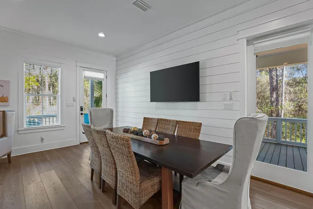 a kitchen with white cabinets and appliances