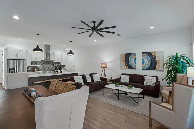 a kitchen with stainless steel appliances granite countertop a refrigerator sink and stove