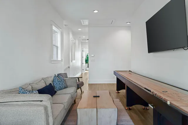 a bedroom with a bed and a flat screen tv in it