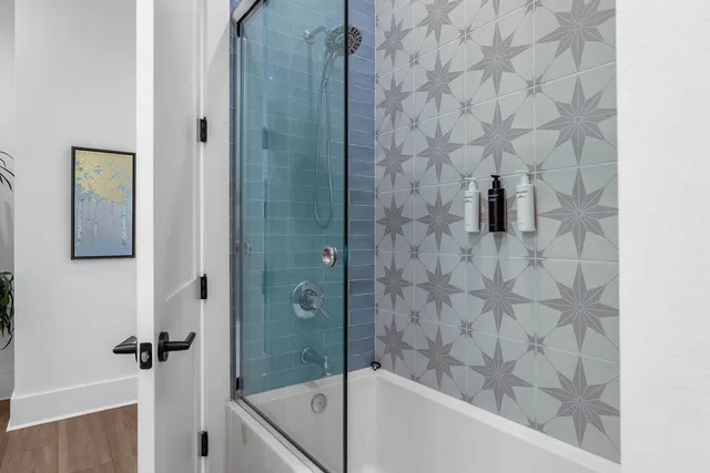 a bedroom with a bed and a television