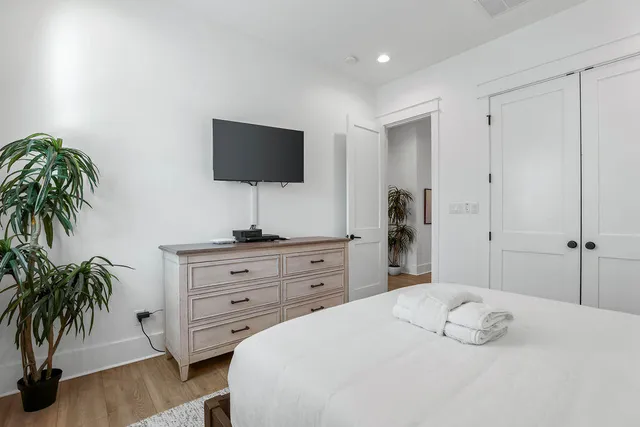 a bedroom with furniture and a window