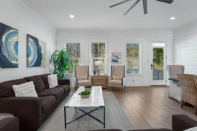 a living room filled with furniture and a potted plant