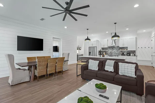 a living room with furniture and a potted plant