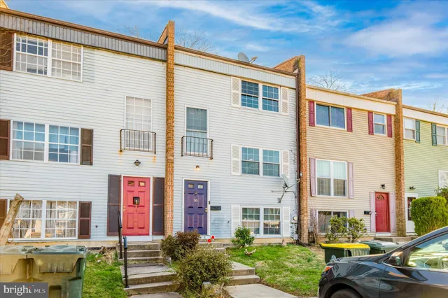 a front view of a building with parking space