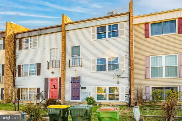 a view of a brick building with many windows