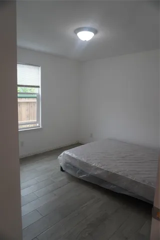 a room with a bed and a window
