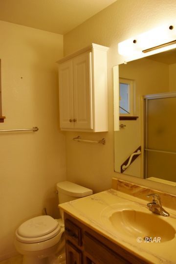 111 North American Street Ridgecrest, CA 93555 - Photo 7 of 10 a bathroom with a sink and a toilet