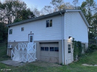 10682 Ravenswood Road Ravenswood, WV 26164 - Photo 26 of 46 Back of house featuring a garage