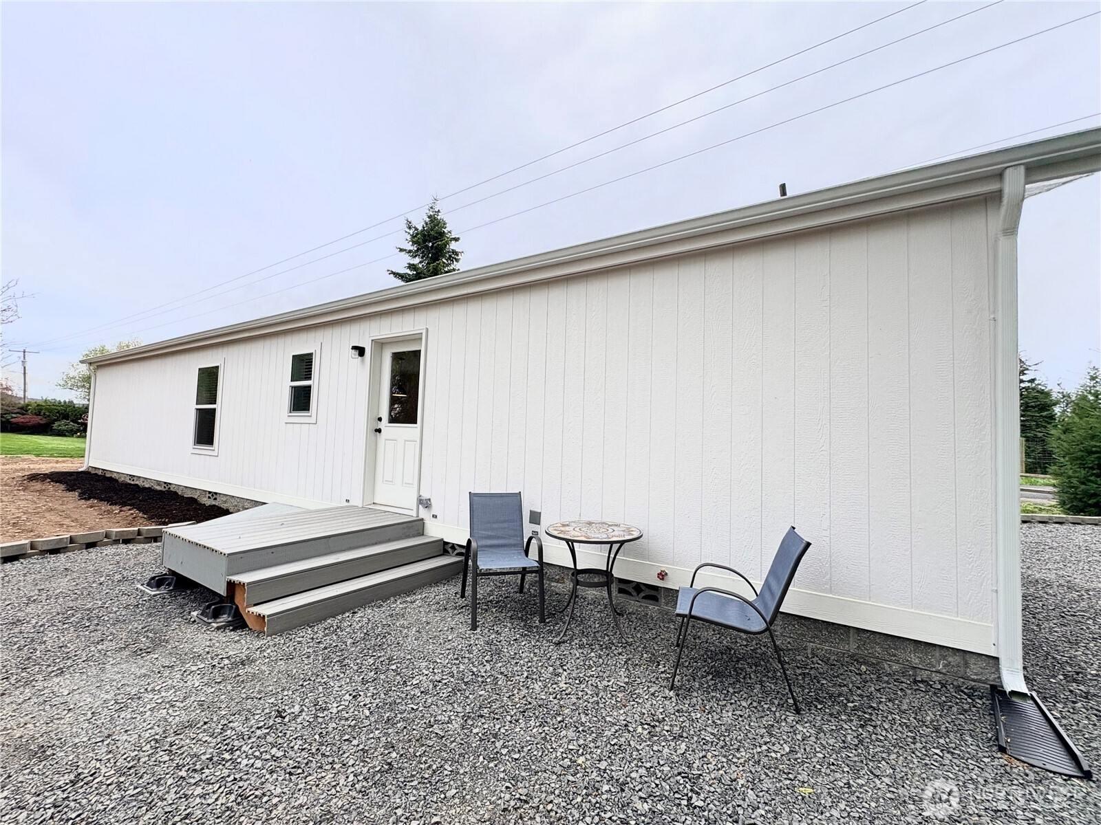 763 Eadon Road Toledo, WA 98591 - Photo 26 of 28 a view of backyard of house with wooden floor and seating space