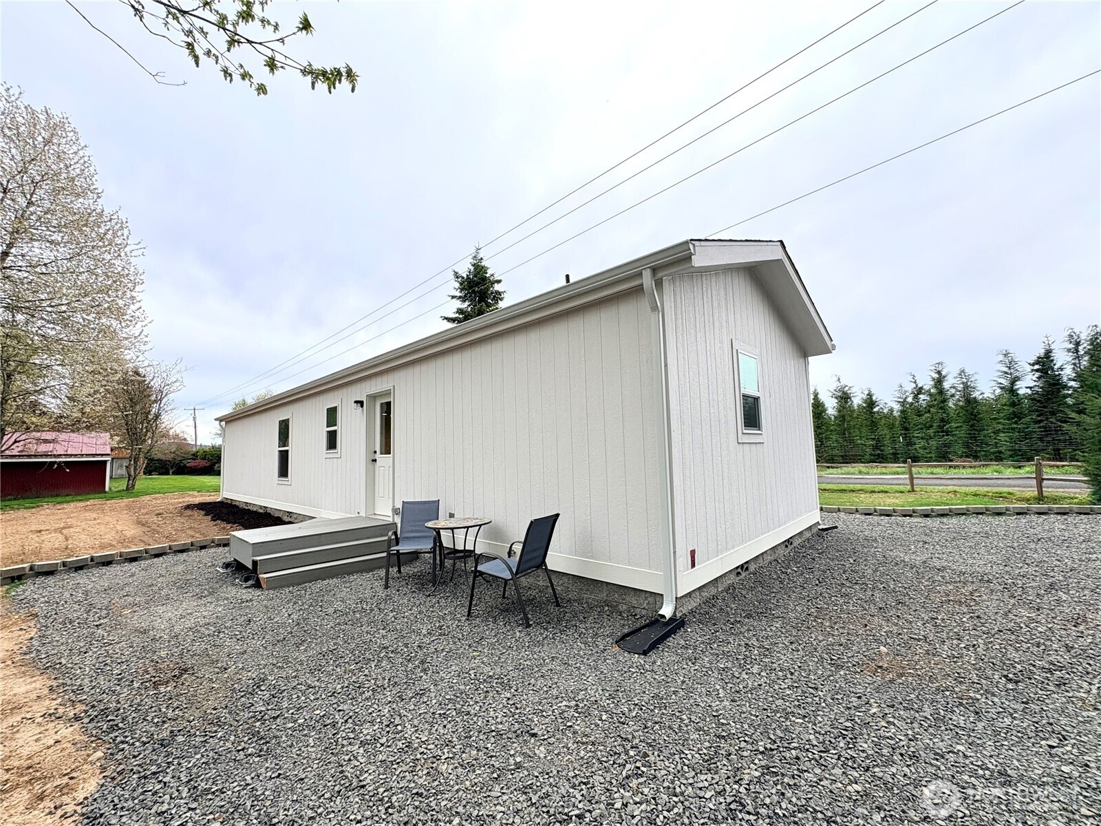 763 Eadon Road Toledo, WA 98591 - Photo 27 of 28 a backyard of a house with table and chairs