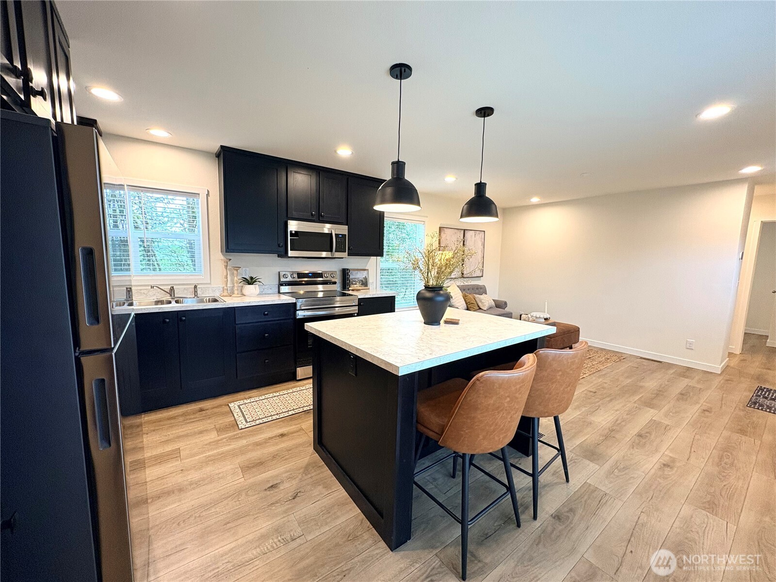 763 Eadon Road Toledo, WA 98591 - Photo 8 of 28 a kitchen with a sink a counter top space appliances and cabinets