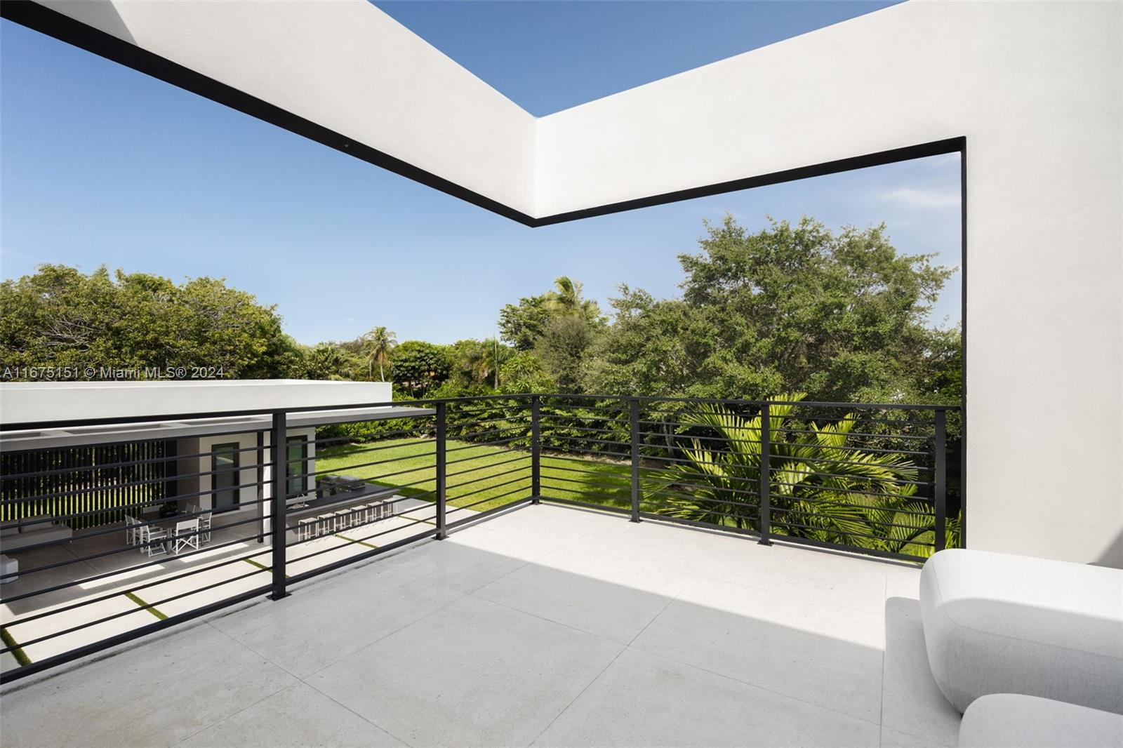 7425 Southwest 136th Street Pinecrest, FL 33156 - Photo 39 of 60 a view of a balcony with chairs