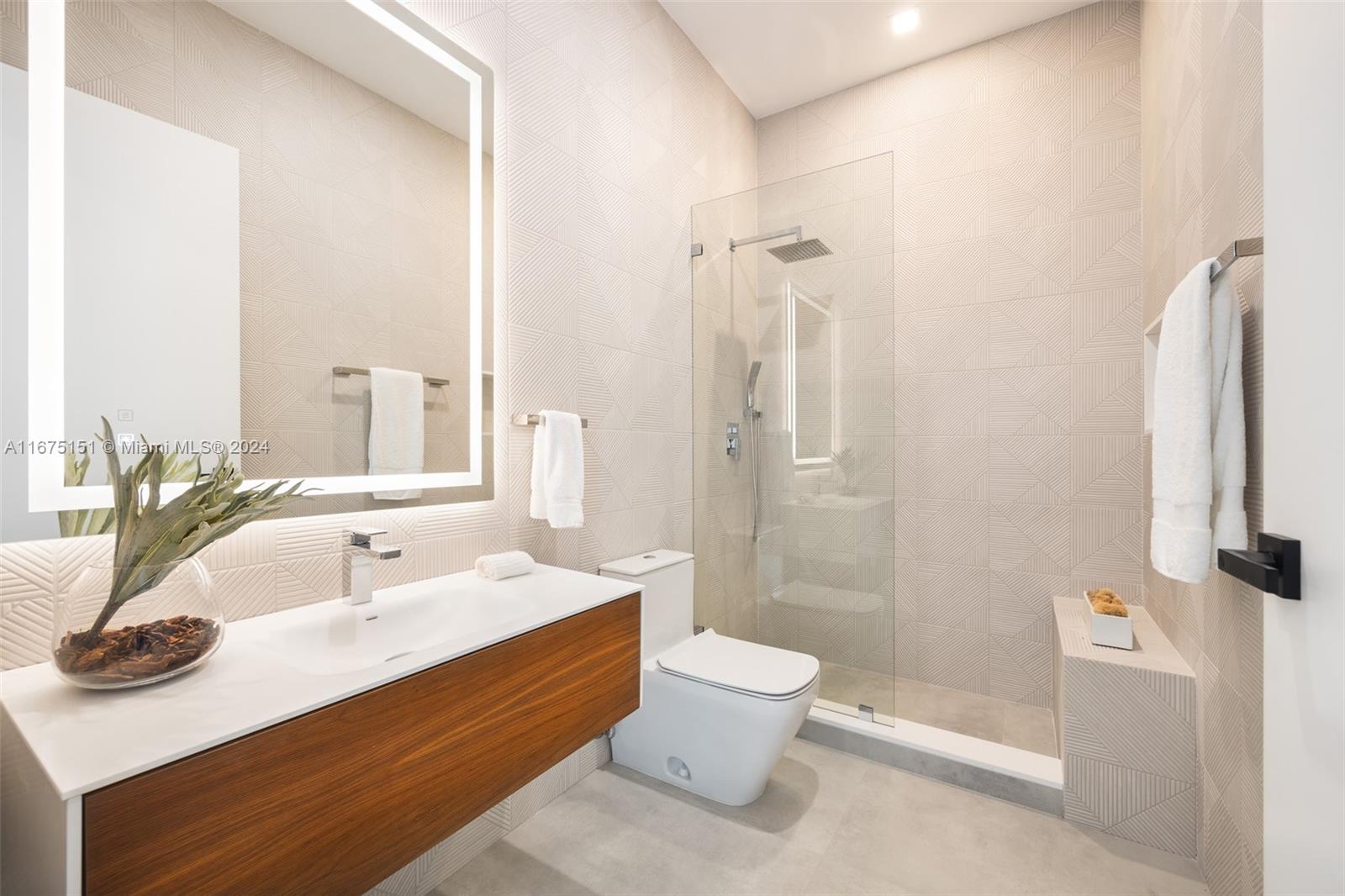 7425 Southwest 136th Street Pinecrest, FL 33156 - Photo 45 of 60 a bathroom with a sink and a large mirror