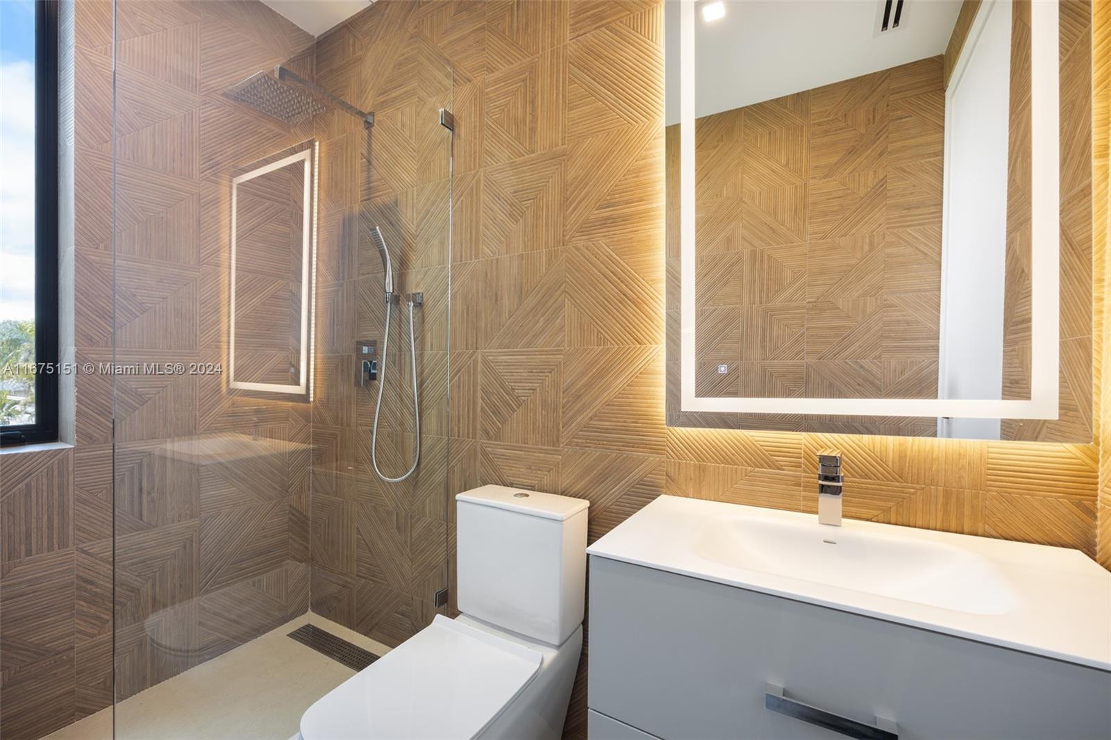 7425 Southwest 136th Street Pinecrest, FL 33156 - Photo 48 of 60 a bathroom with a sink and a mirror
