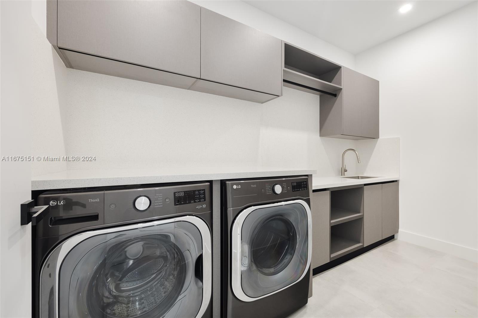 7425 Southwest 136th Street Pinecrest, FL 33156 - Photo 50 of 60 a utility room with dryer and washer