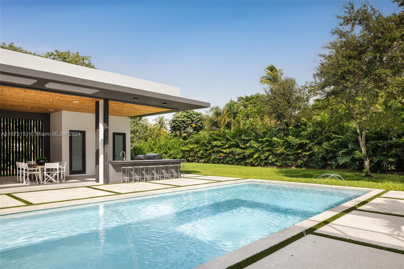 7425 Southwest 136th Street Pinecrest, FL 33156 - Photo 54 of 60 a view of swimming pool with patio