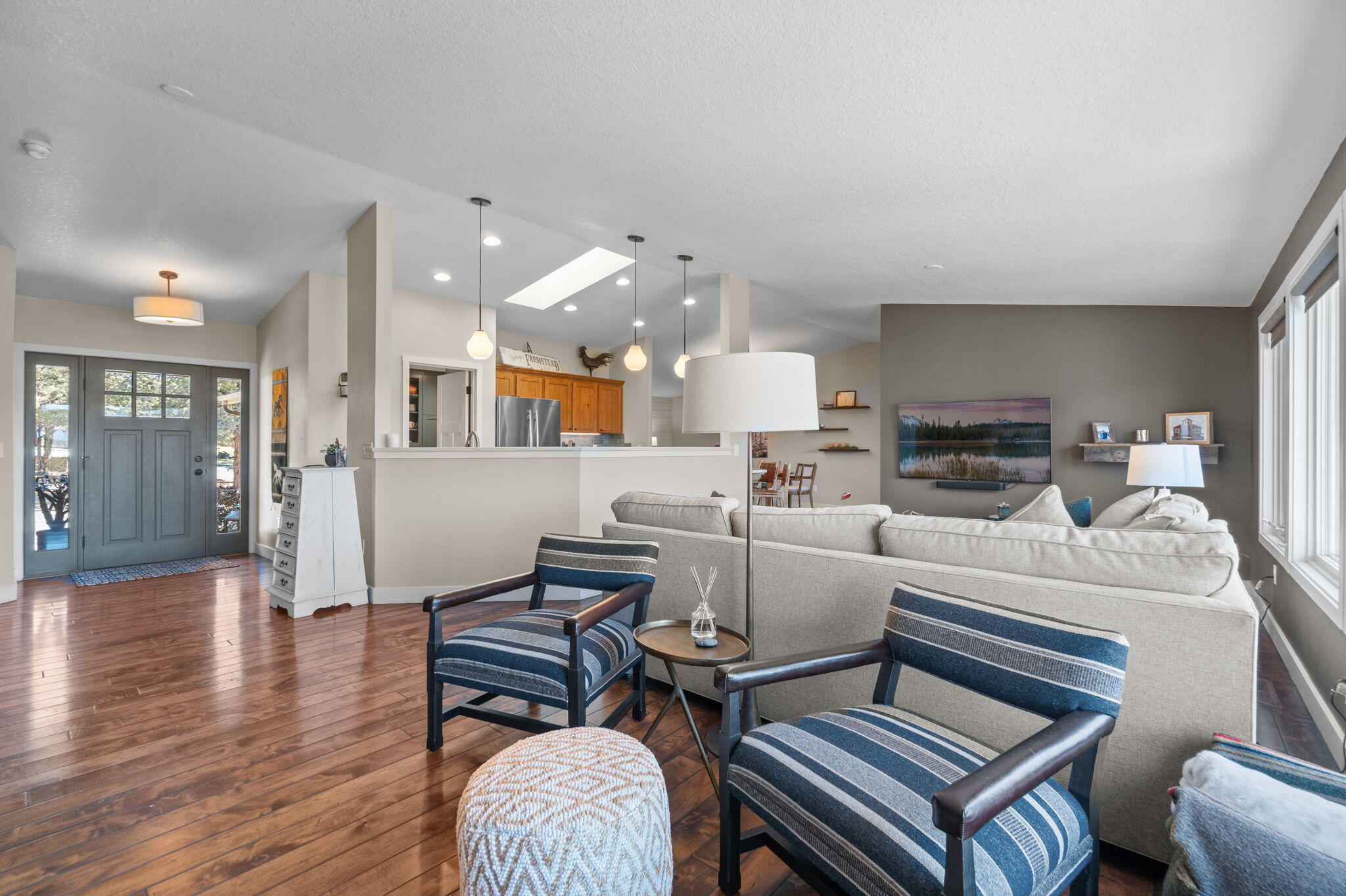 19395 Innes Market Road Bend, OR 97703 - Photo 11 of 75 a living room with furniture fireplace and wooden floor
