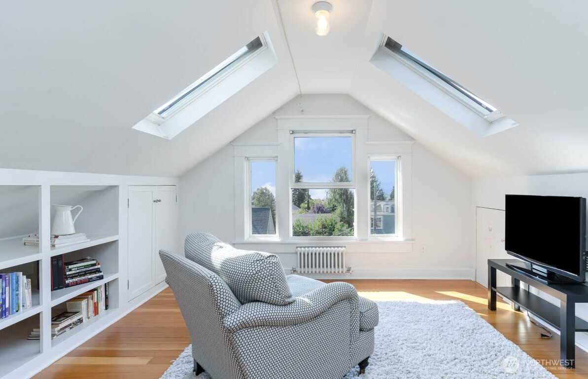 1607 6th Avenue West Seattle, WA 98119 - Photo 16 of 27 a living room with furniture and a flat screen tv