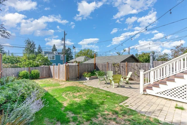 a view of a chair and tables in the patio