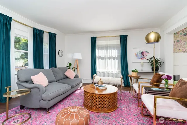a living room with furniture rug and window